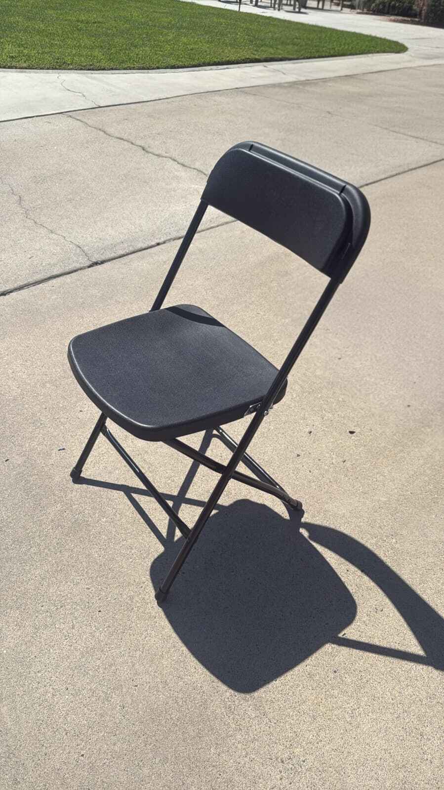 Black folding chair rentals for event seating